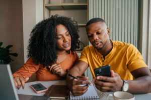 A couple reviews their details after calling StAK Insurances Solutions, one of the top Insurance Agencies Morton IL has to offer