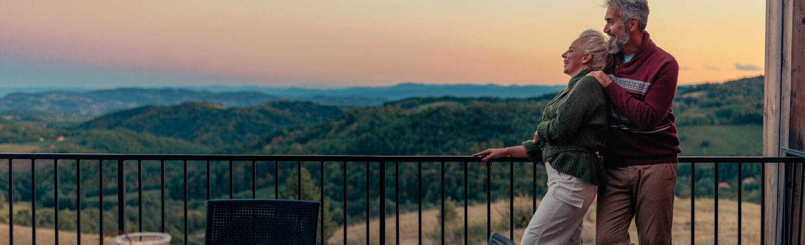 A couple who explored annuities Morton IL residents use for retirement income planning enjoy a vacation in the mountains