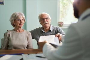 A couple meets with a doctor after researching Medicare Providers Morton IL trusts with StAK Insurance Solutions
