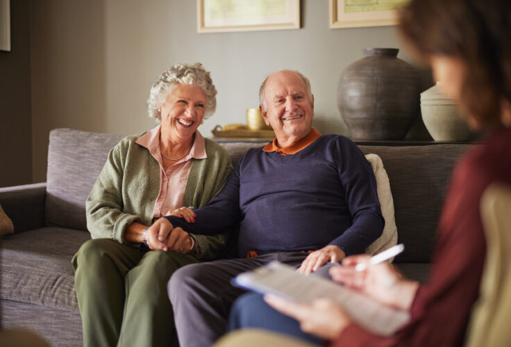 An elderly couple meets with Insurance Agencies Peoria IL trusts